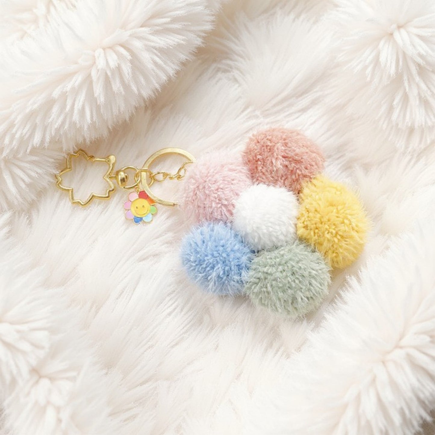 Anna-Kaci Multicolor Pom Pom Keychain with Gold Flower Charm and Smiley Accent