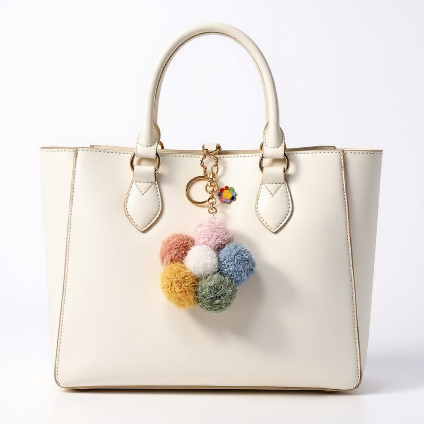 Anna-Kaci Multicolor Pom Pom Keychain with Gold Flower Charm and Smiley Accent