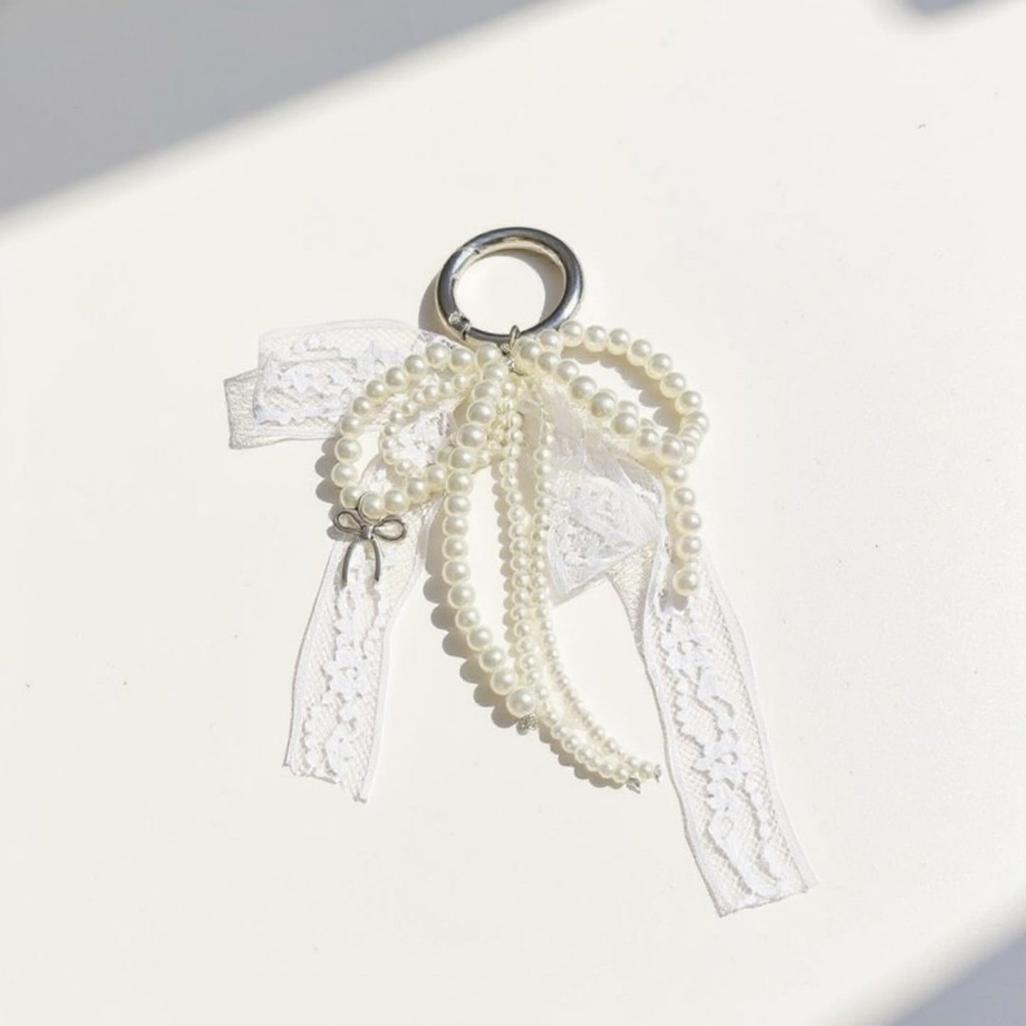 Anna-Kaci Pearl and Lace Bow Keychain with Silver Ring and Charm Accent
