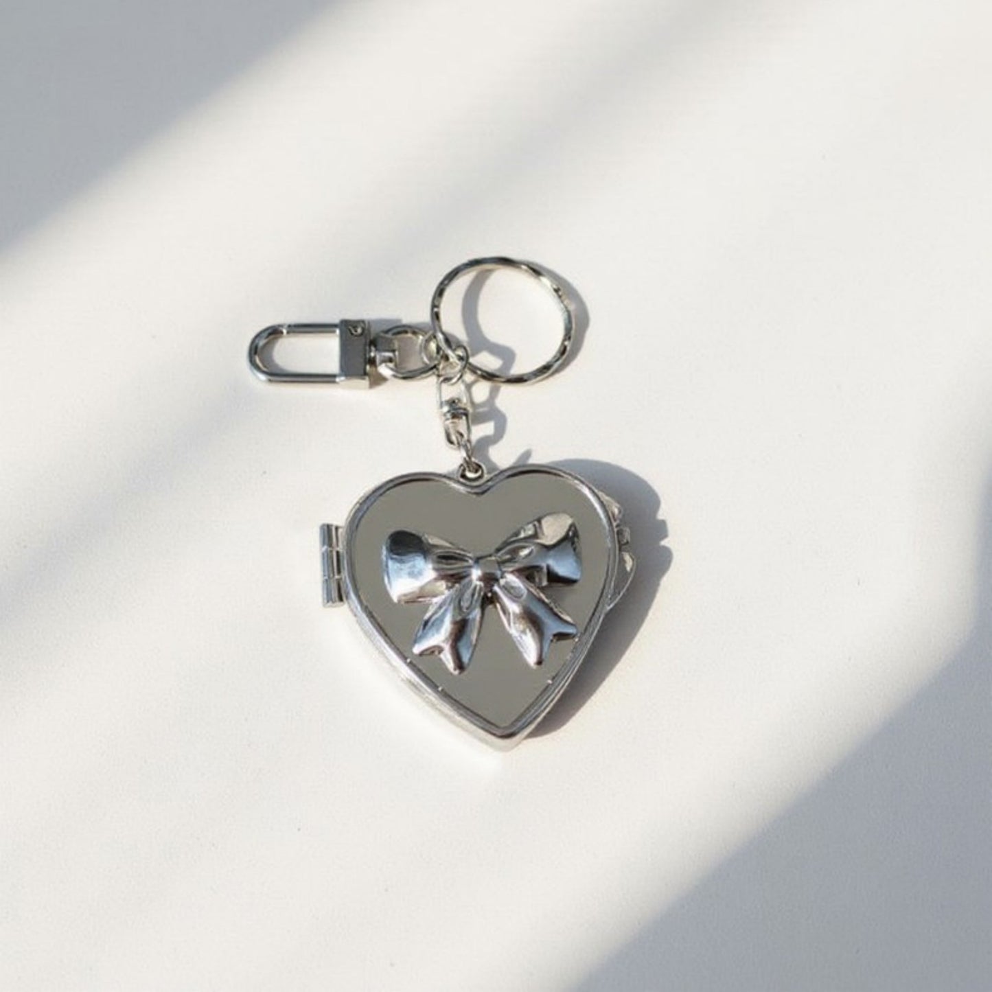 Anna-Kaci Silver Heart Locket Keychain with 3D Bow Detail and Clasp Ring