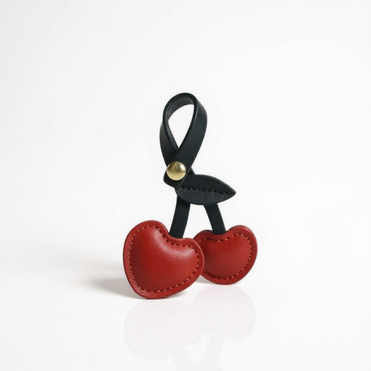 Anna-Kaci Faux Leather Cherry Heart Keychain with Black Leaf Strap and Gold Rivet Detail