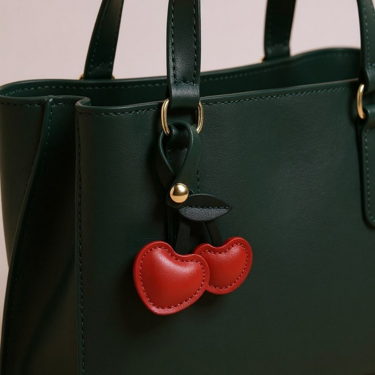Anna-Kaci Faux Leather Cherry Heart Keychain with Black Leaf Strap and Gold Rivet Detail