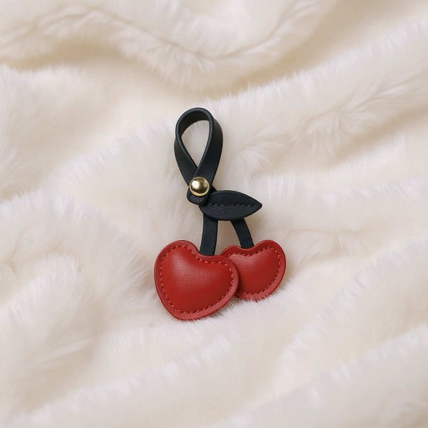 Anna-Kaci Faux Leather Cherry Heart Keychain with Black Leaf Strap and Gold Rivet Detail