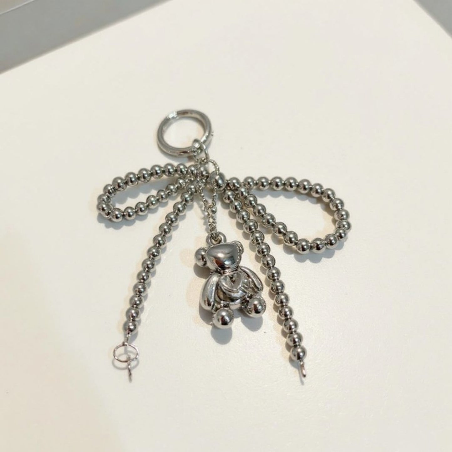 Anna-Kaci Metallic Beaded Bow Keychain with Crystal Bear Charm and Ring Accent