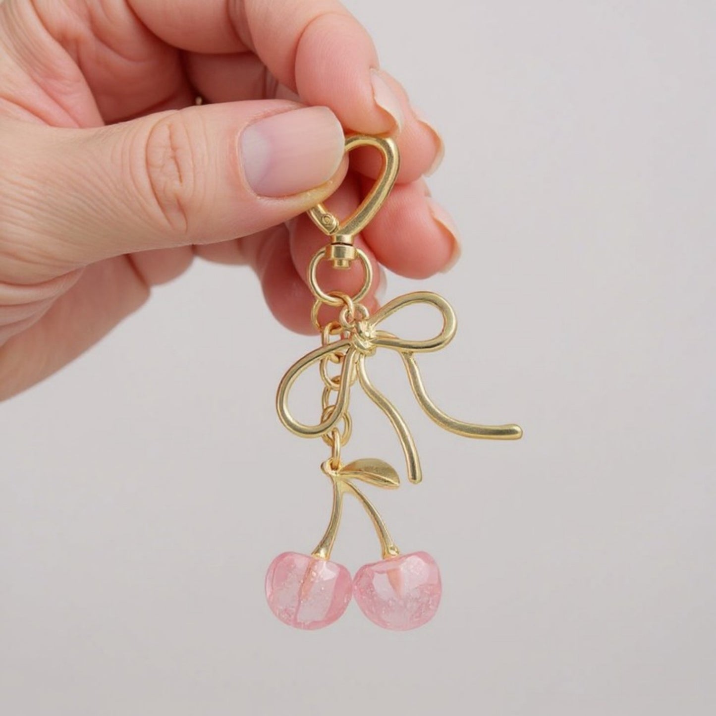 Anna-Kaci Gold Bow Keychain with Pink Cherry Charms and Heart Clasp