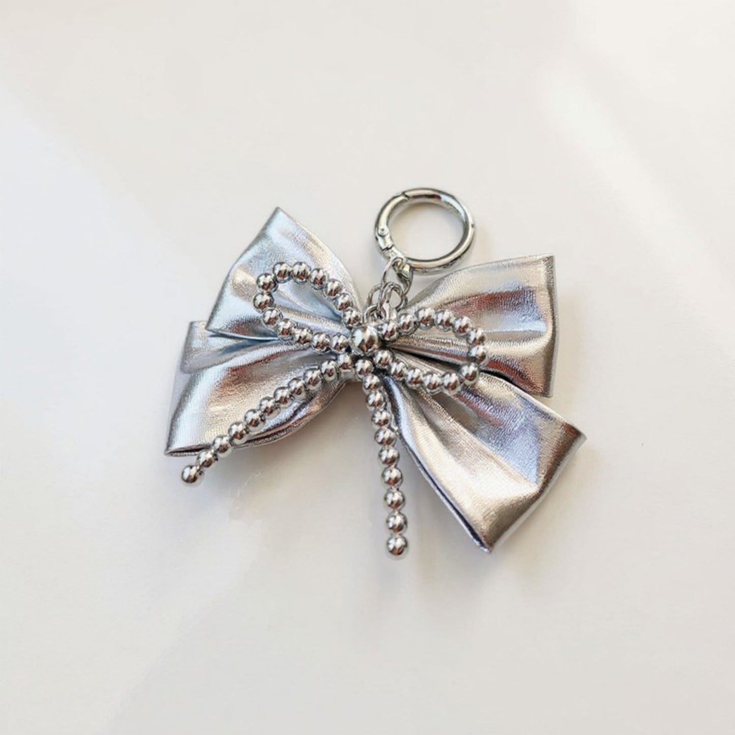 Anna-Kaci Metallic Bow Charm Keychain with Silver Beaded Detailing