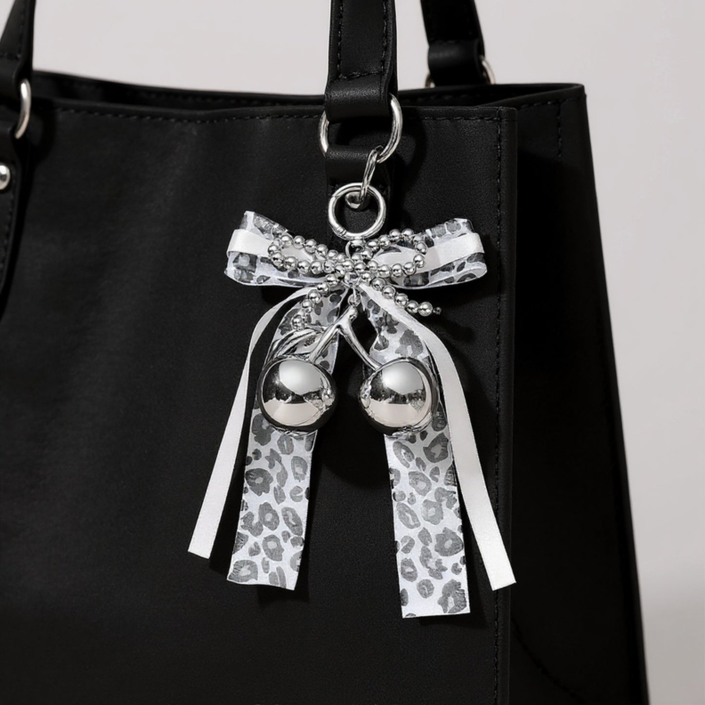 Anna-Kaci Leopard Print Ribbon Keychain with Pearl Bow and Cherry Charms