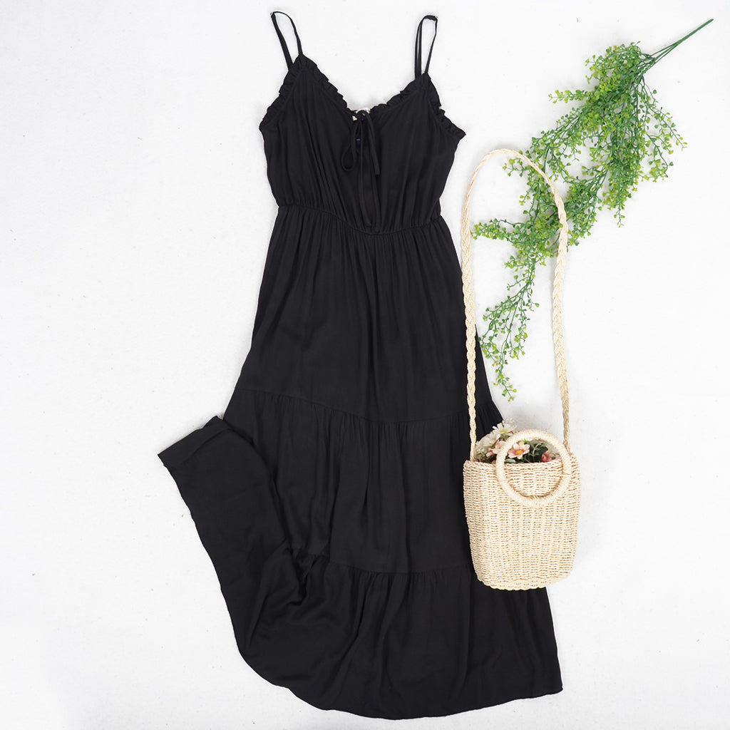 Vestido con tirantes y dobladillo con volantes en color liso