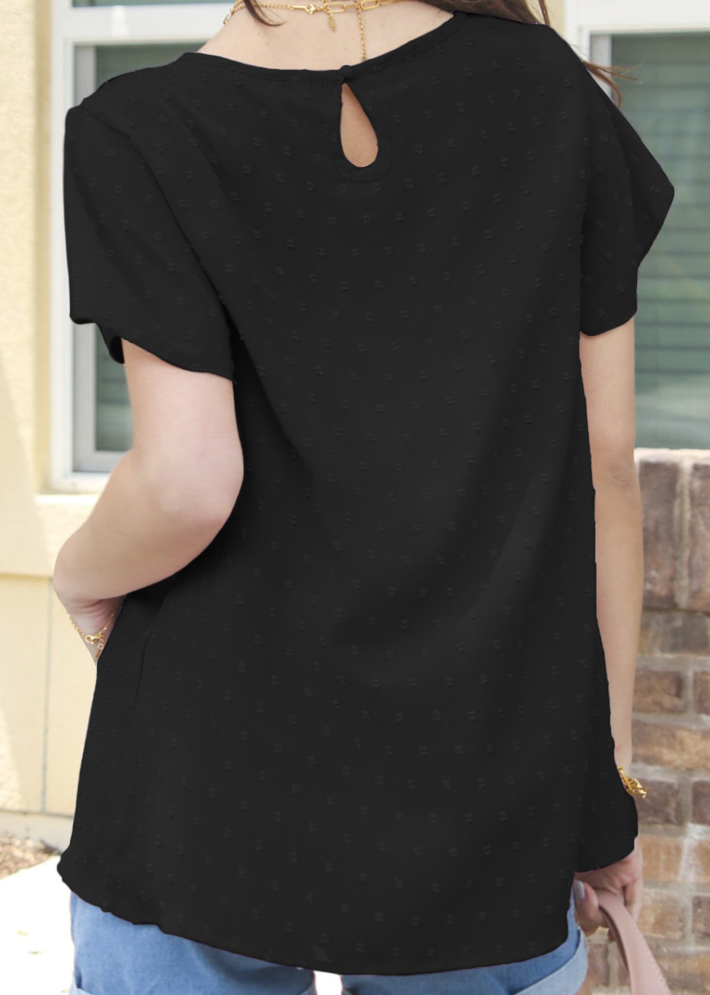 Blusa de lunares suizos con detalle de ojales