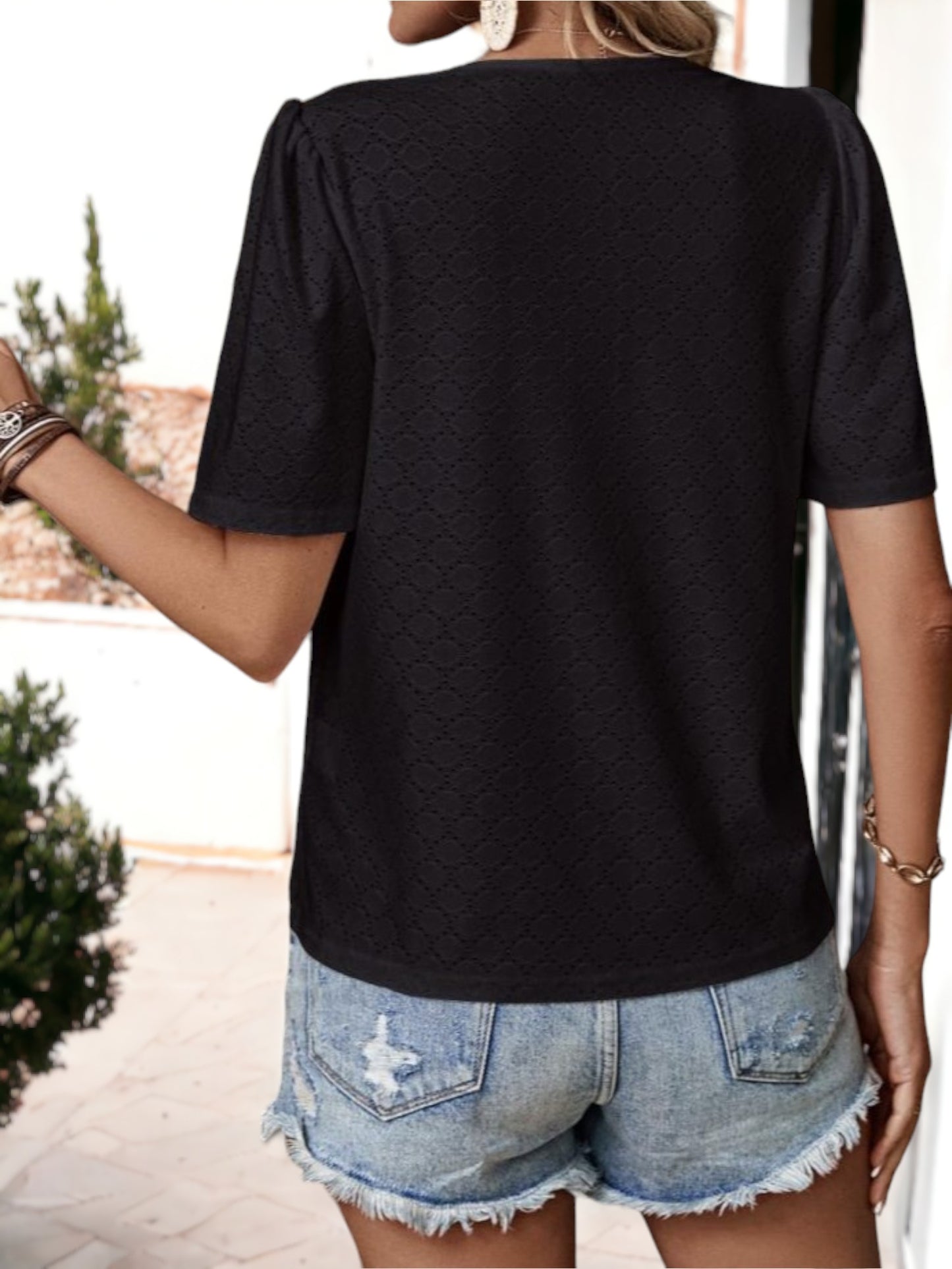 Blusa holgada transpirable con escote en V y ojales con botones