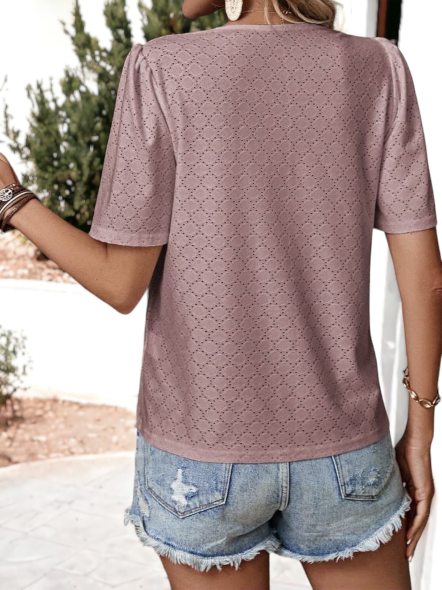 Blusa holgada transpirable con escote en V y ojales con botones