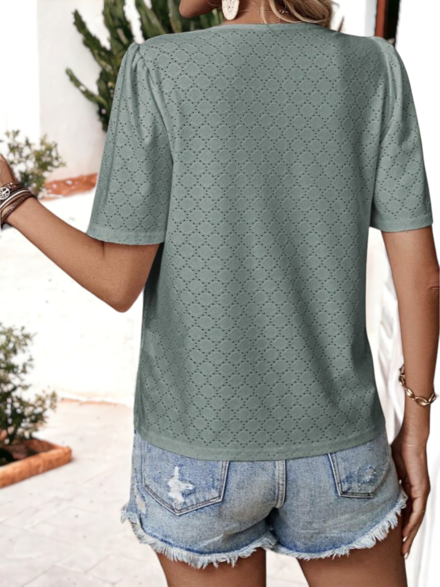 Blusa holgada transpirable con escote en V y ojales con botones