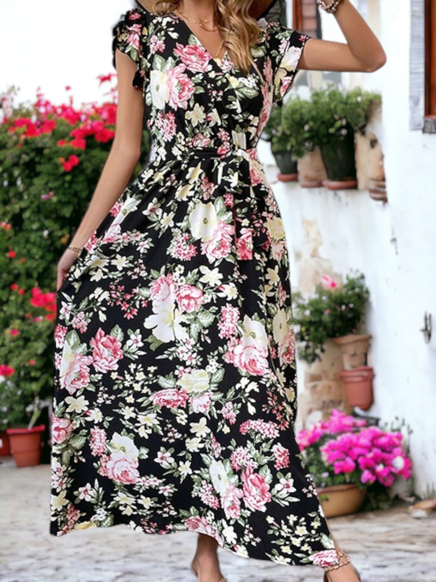 Vestido largo con abertura, mangas con puños, escote en V y estampado floral