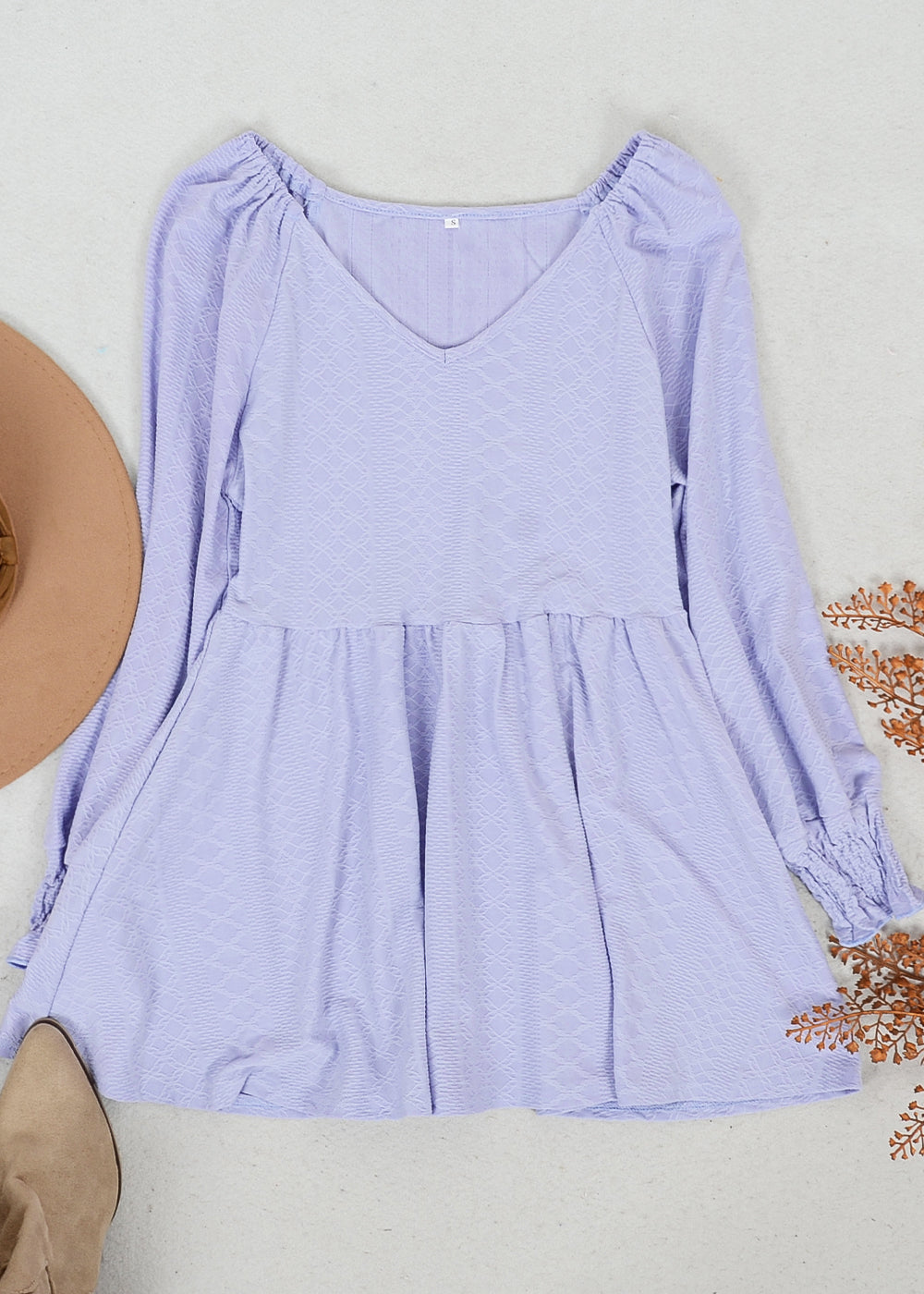 Top largo con escote en V y textura