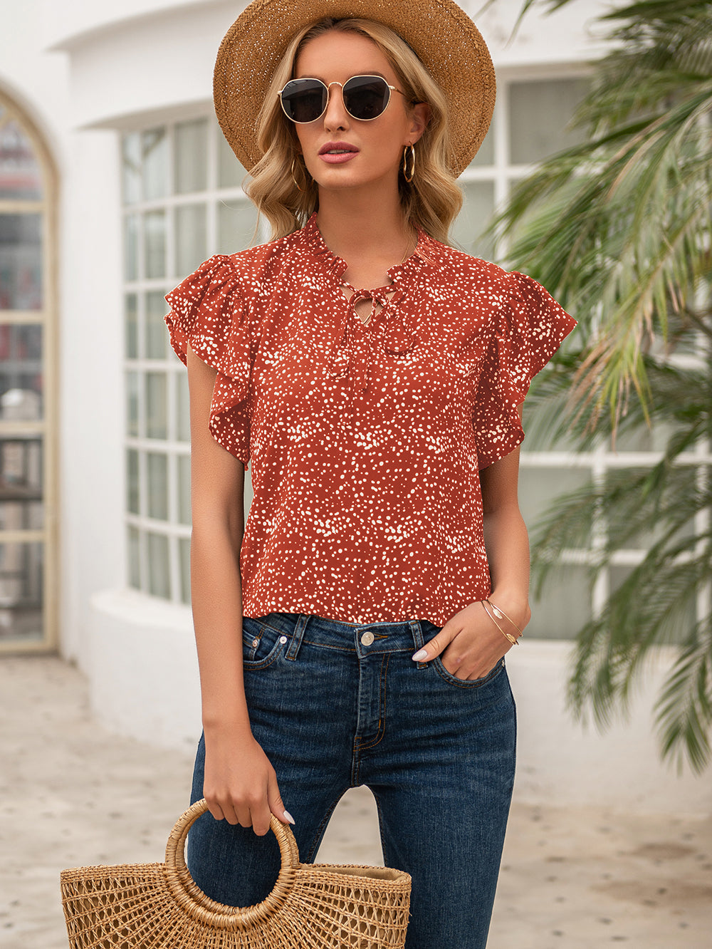 Blusa con volantes y lazo estampado