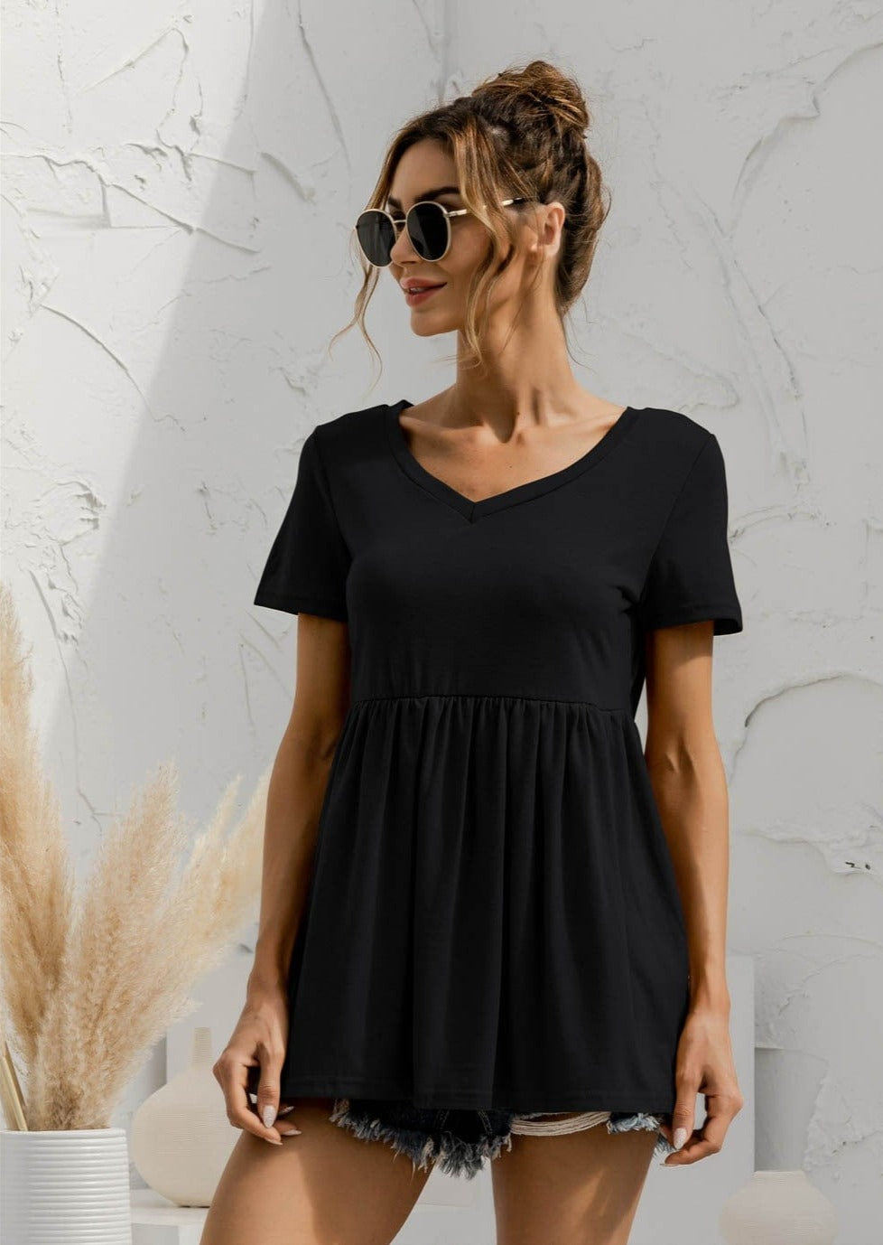 Blusa holgada con peplum liso