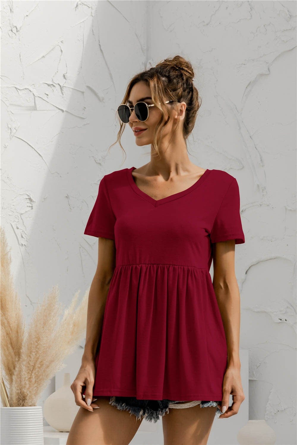 Blusa holgada con peplum liso