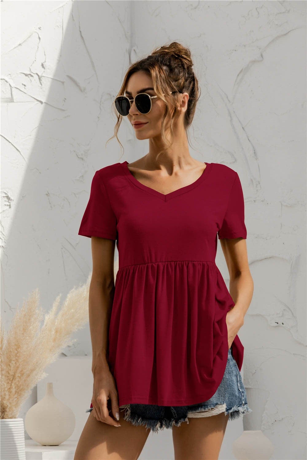 Blusa holgada con peplum liso