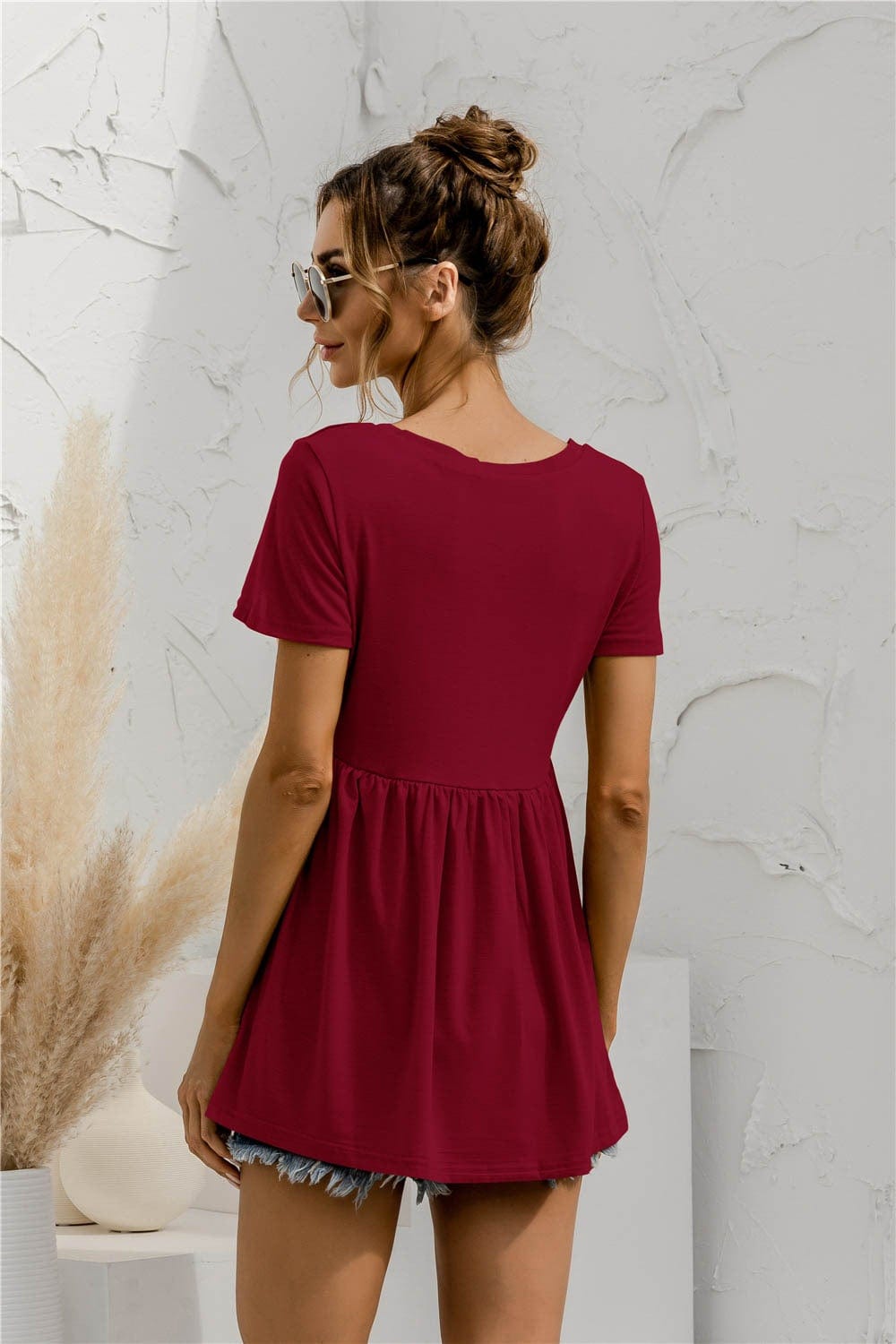 Blusa holgada con peplum liso