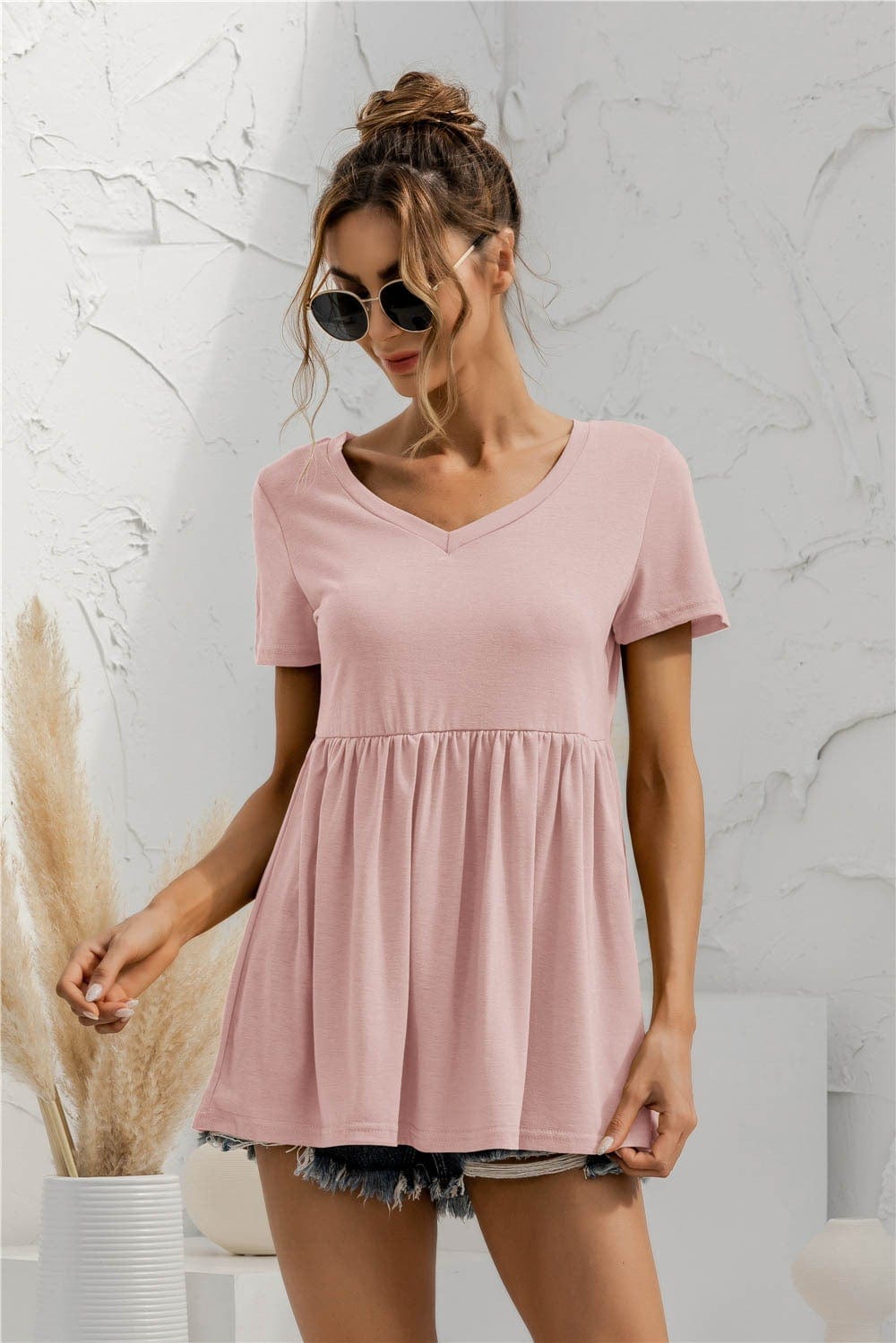 Blusa holgada con peplum liso