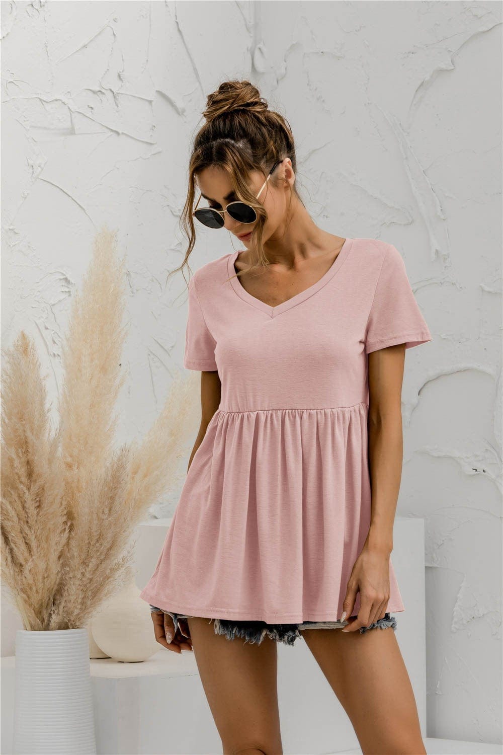 Blusa holgada con peplum liso