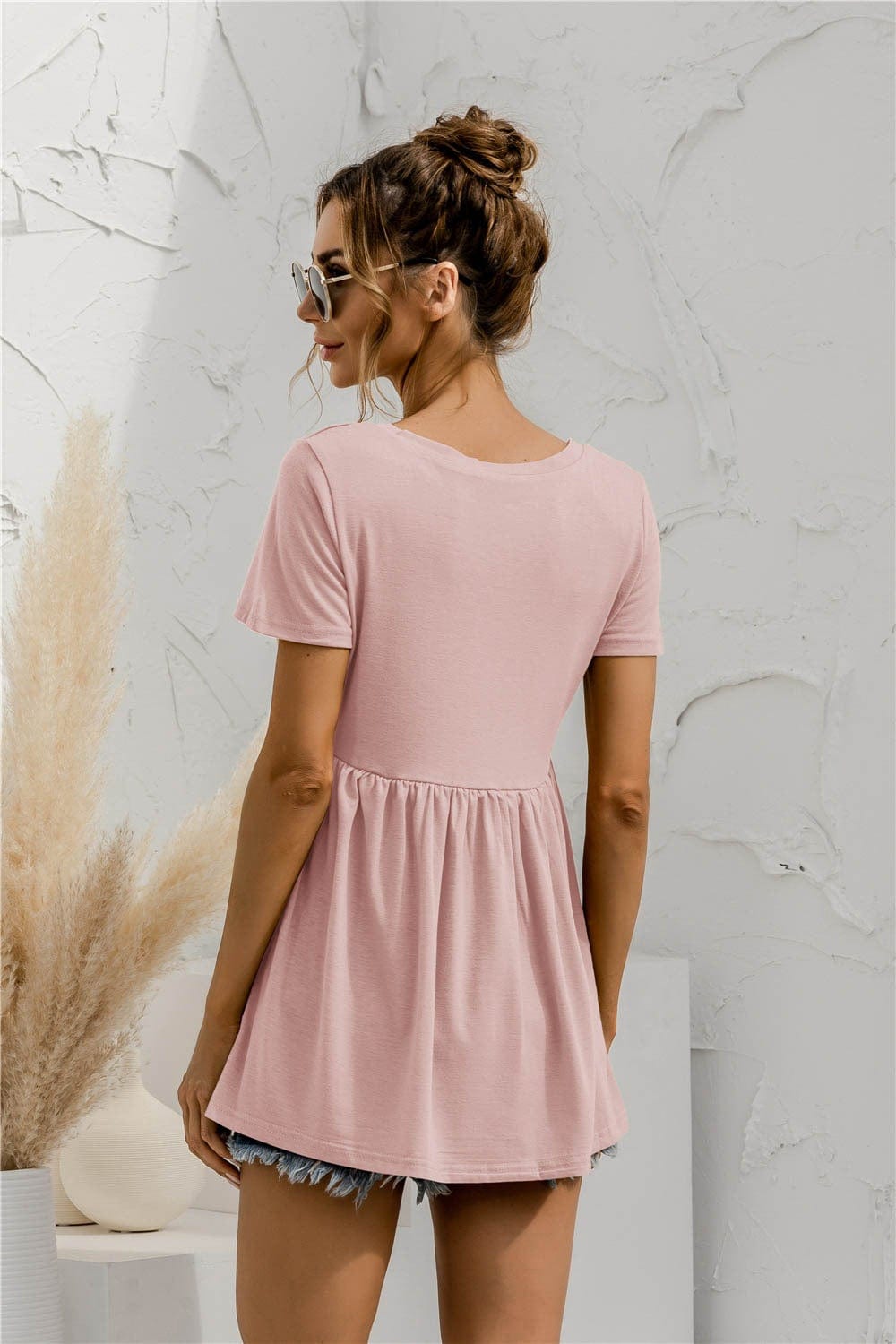 Blusa holgada con peplum liso