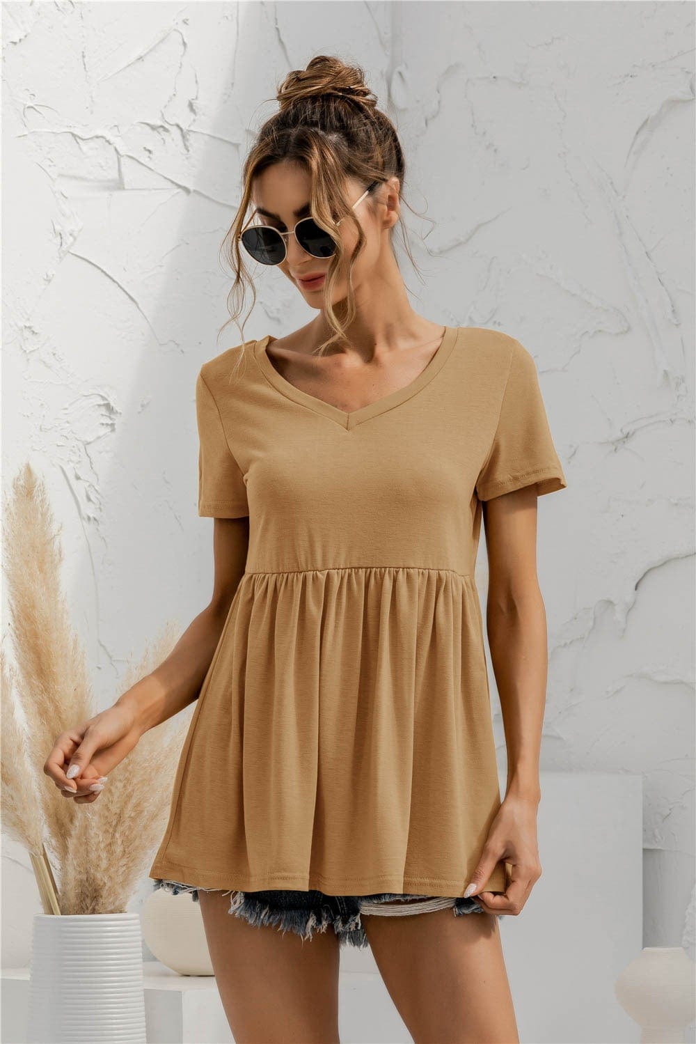 Blusa holgada con peplum liso