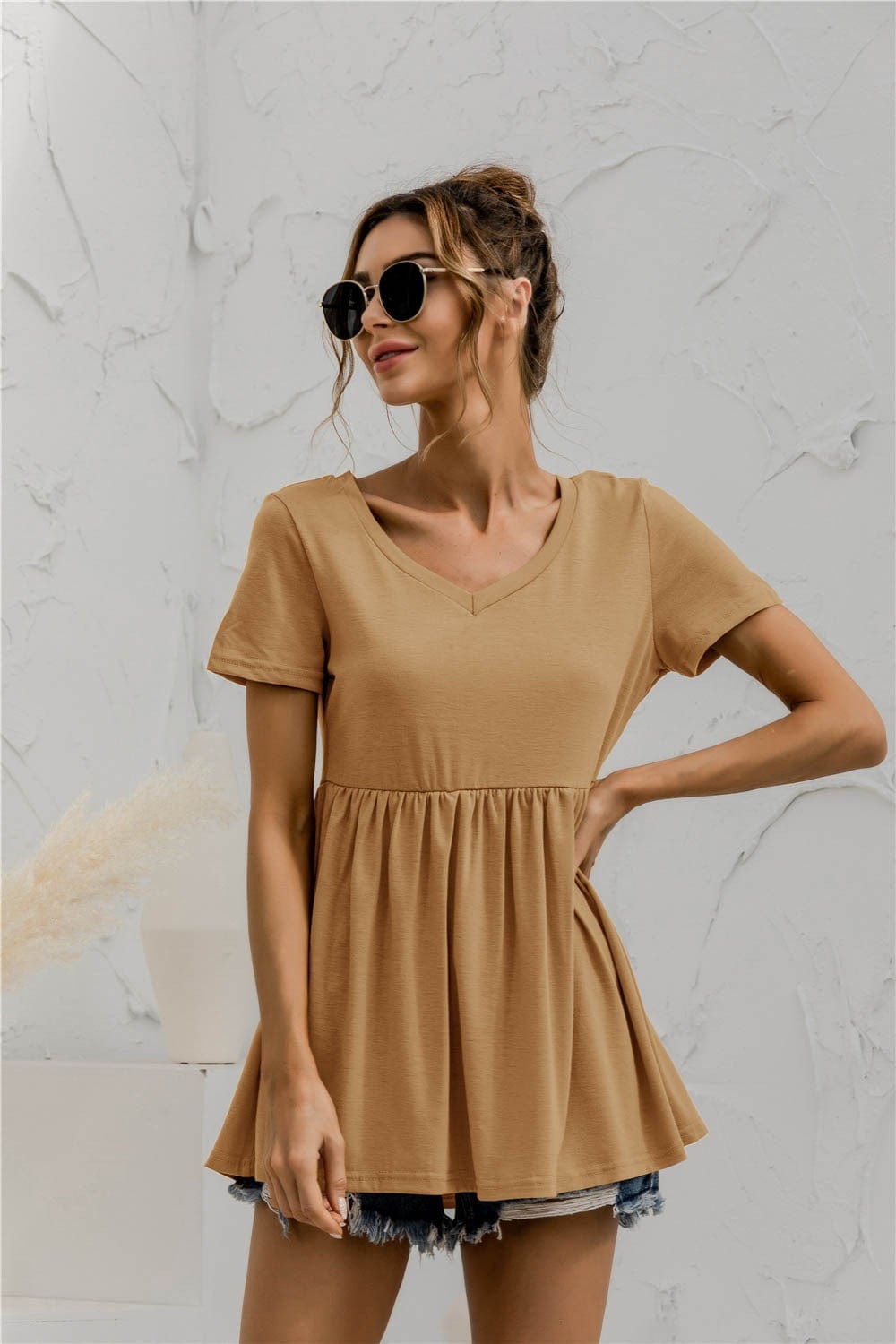 Blusa holgada con peplum liso