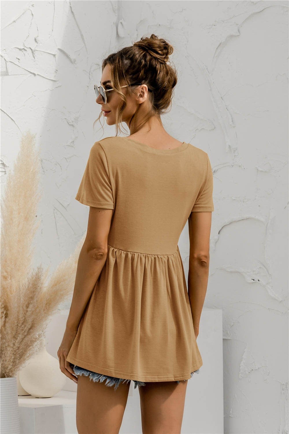 Blusa holgada con peplum liso