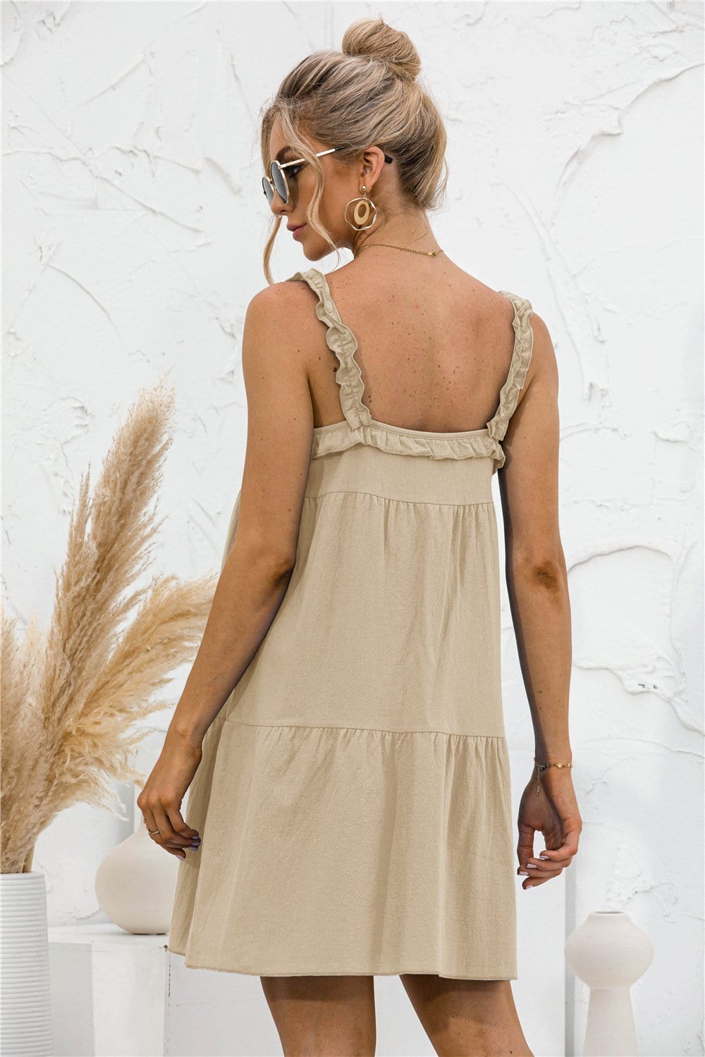 Vestido túnica con volantes y lazo