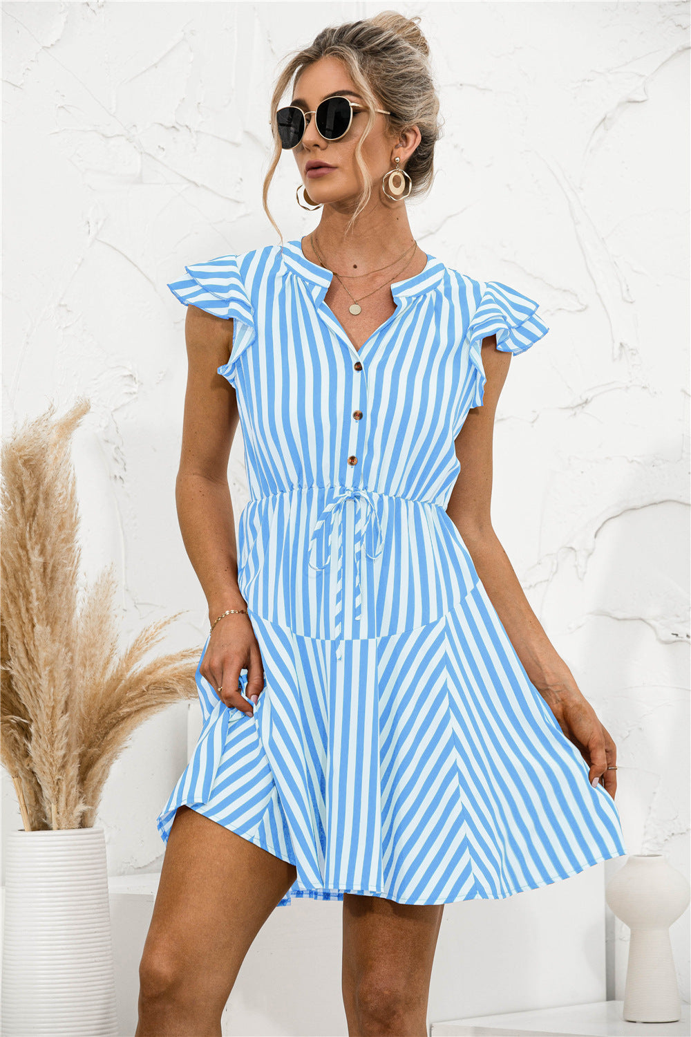 Vestido mini túnica con volantes y rayas