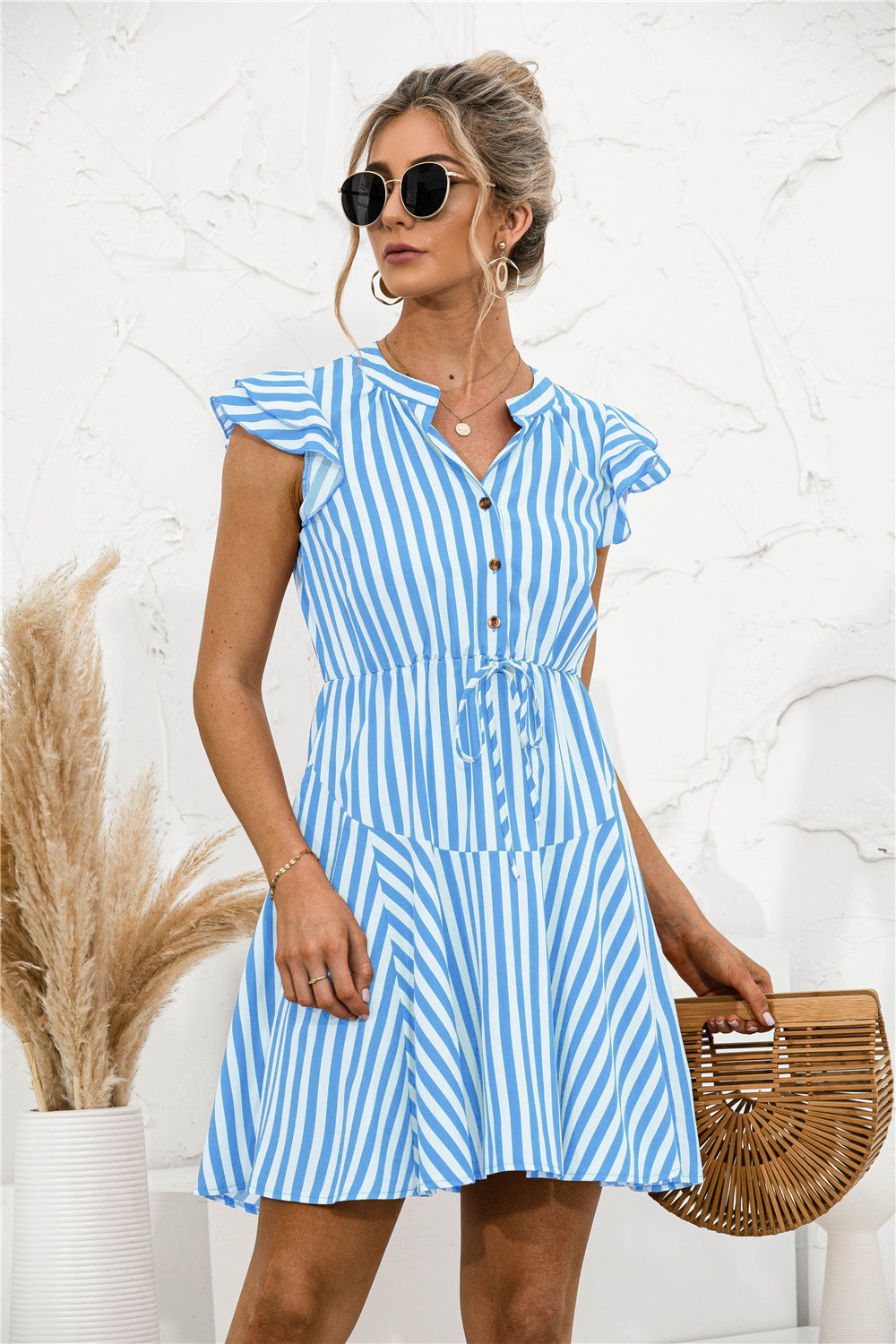 Vestido mini túnica con volantes y rayas