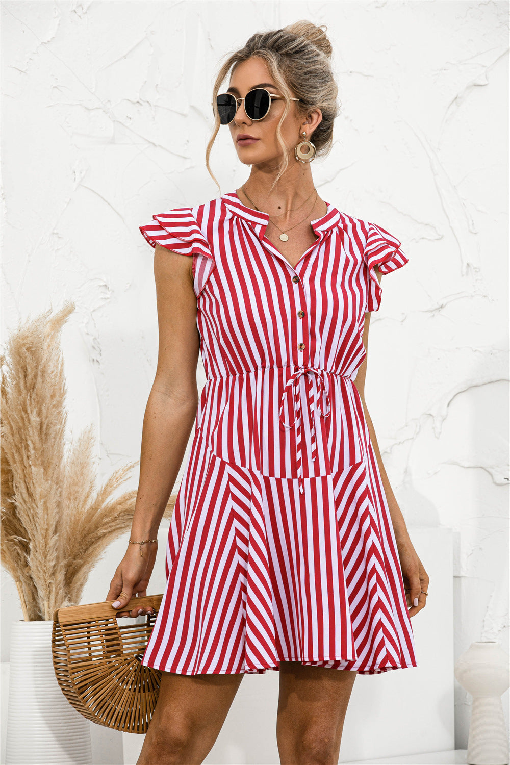 Vestido mini túnica con volantes y rayas