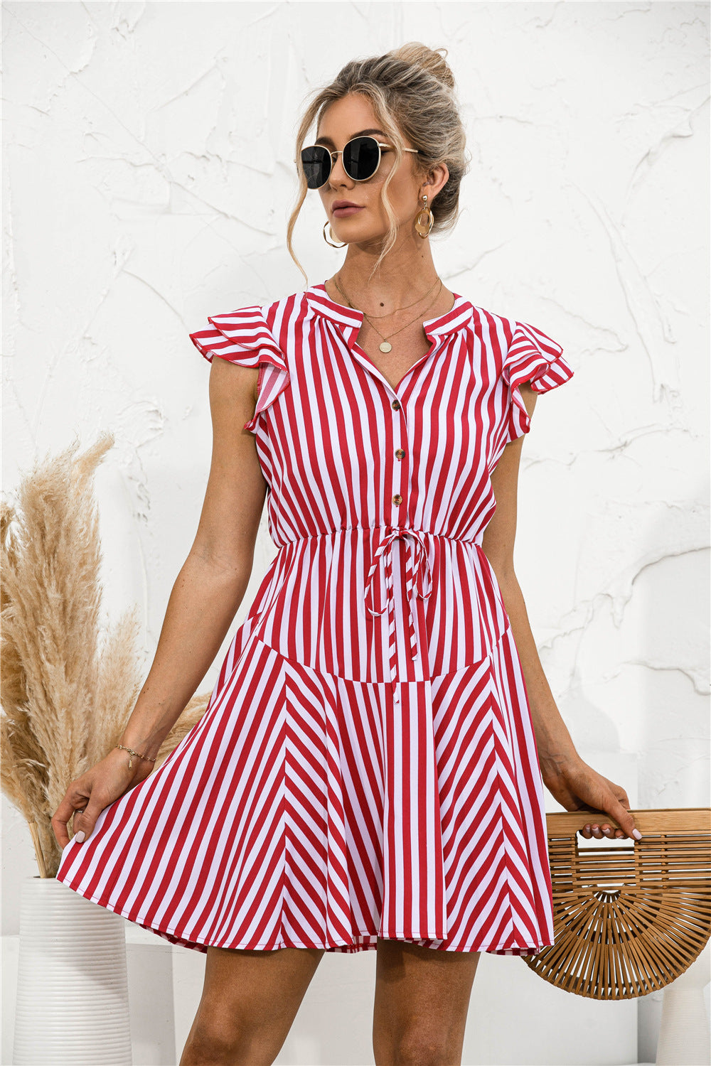 Vestido mini túnica con volantes y rayas
