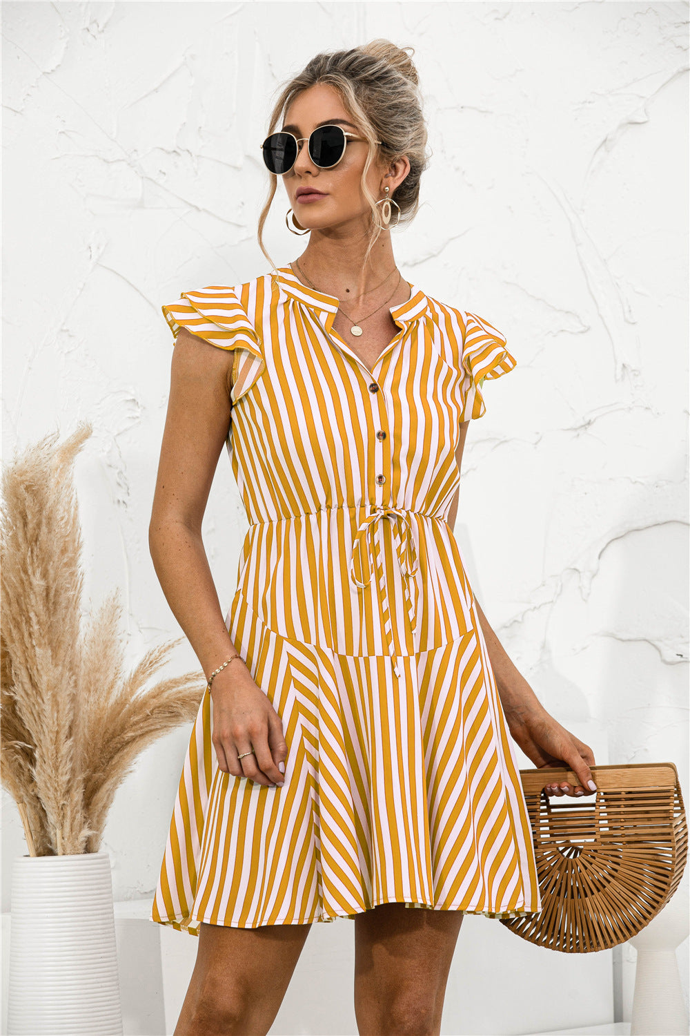 Vestido mini túnica con volantes y rayas
