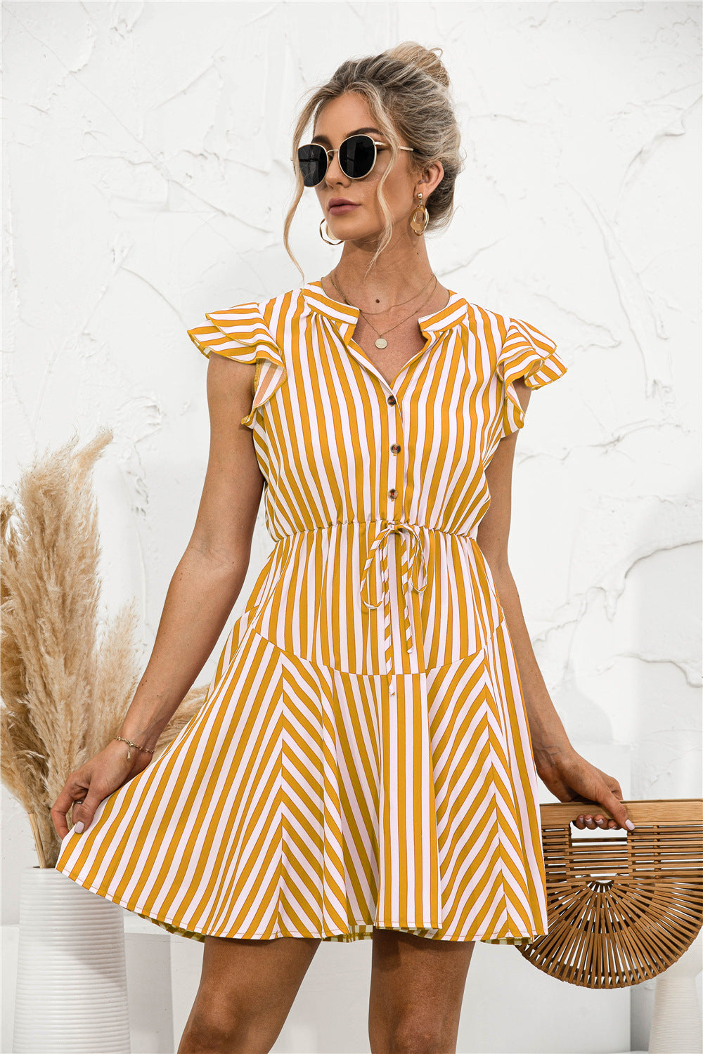 Vestido mini túnica con volantes y rayas