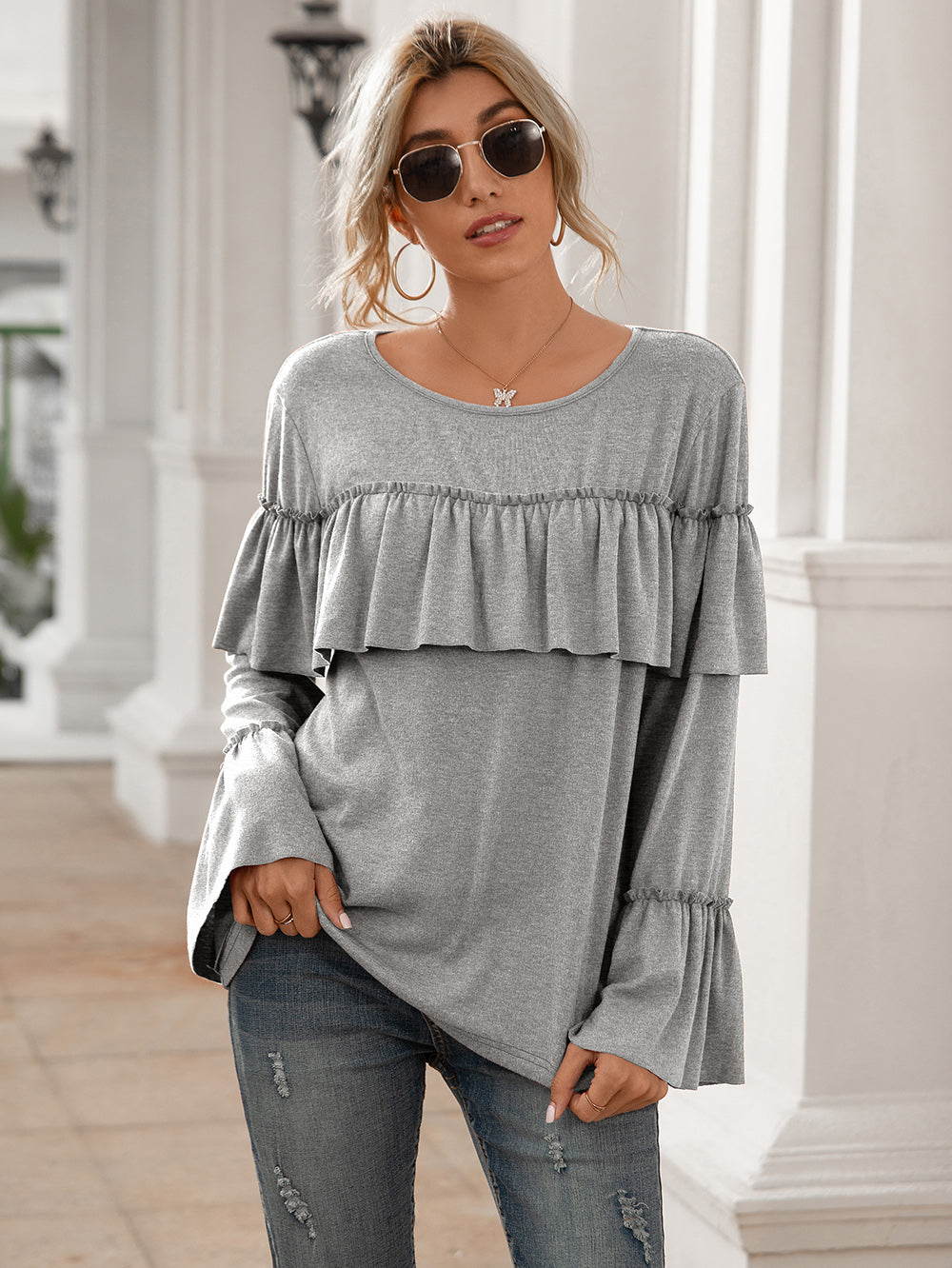 Blusa de manga larga con volantes en el pecho