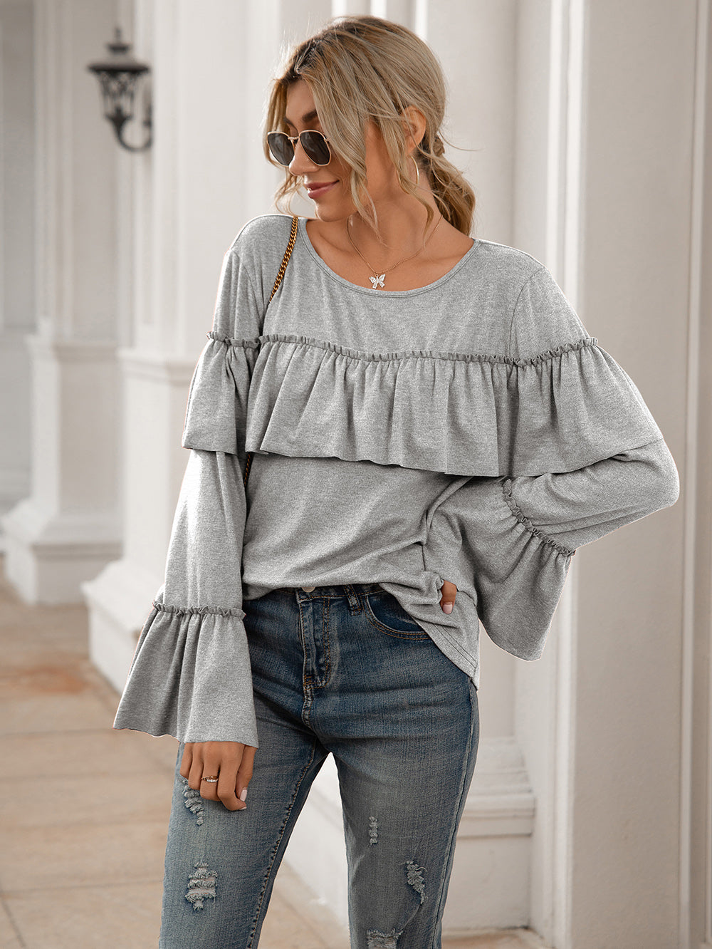 Blusa de manga larga con volantes en el pecho