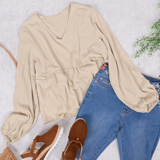 Blusa peplum suave con mangas de obispo