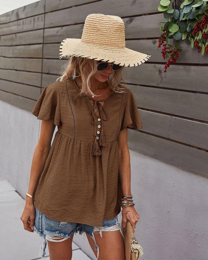 Blusa con mangas sueltas y cuello anudado