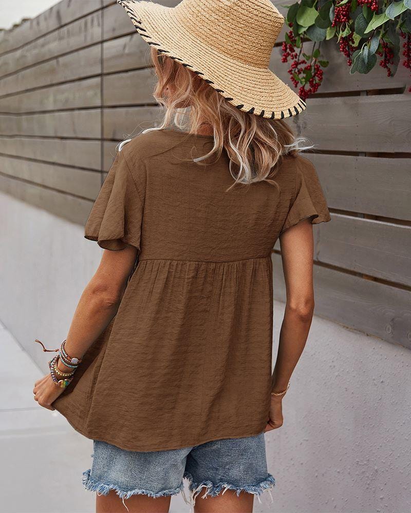 Blusa con mangas sueltas y cuello anudado