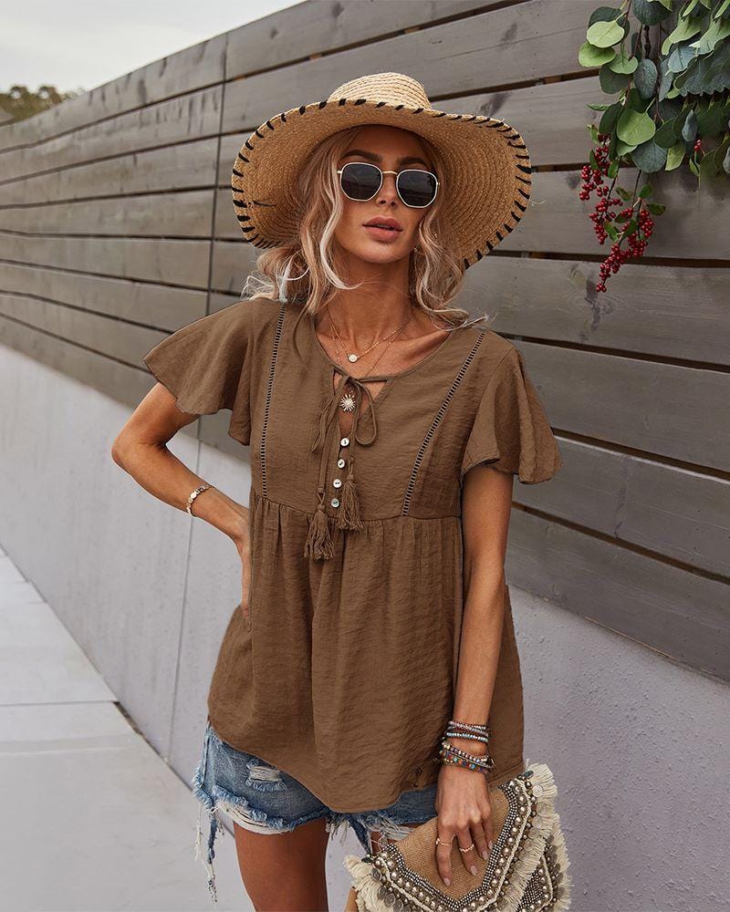 Blusa con mangas sueltas y cuello anudado