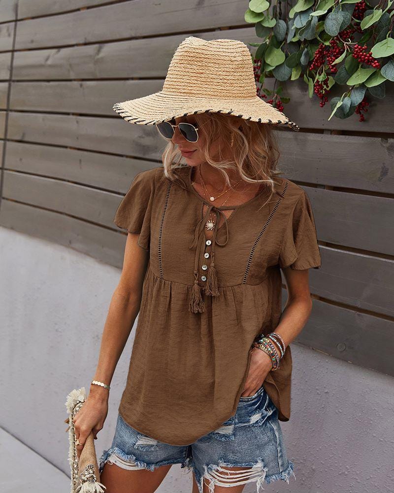 Blusa con mangas sueltas y cuello anudado