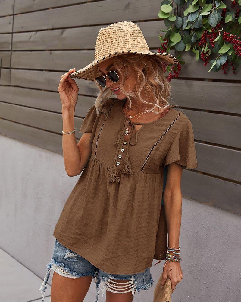Blusa con mangas sueltas y cuello anudado
