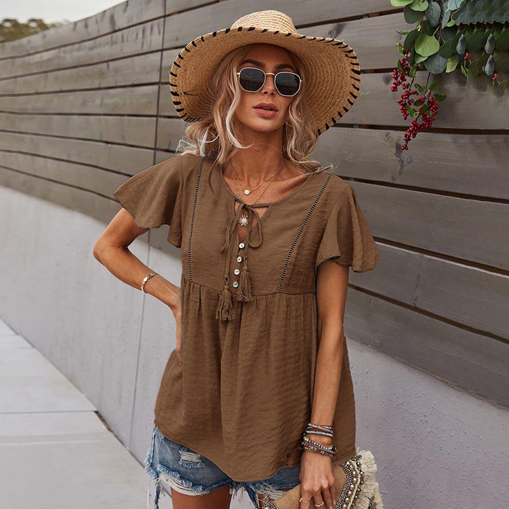 Blusa con mangas sueltas y cuello anudado