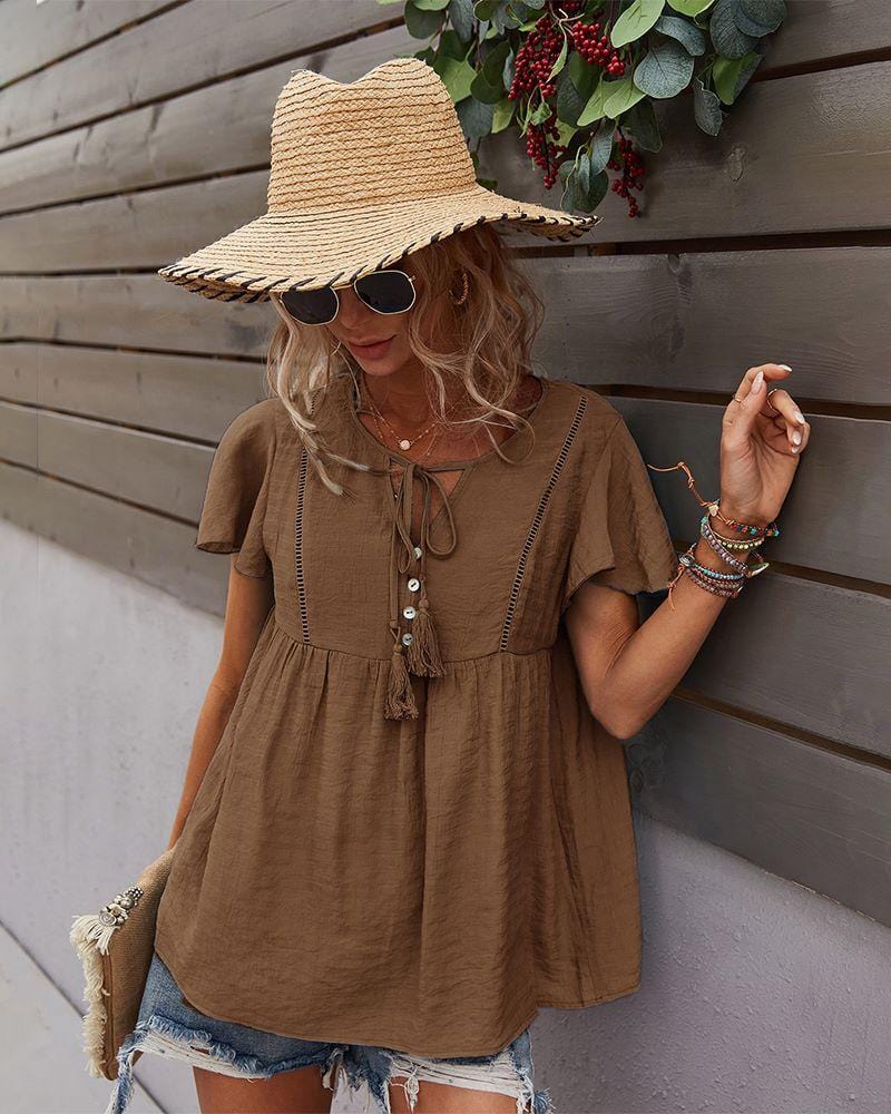 Blusa con mangas sueltas y cuello anudado