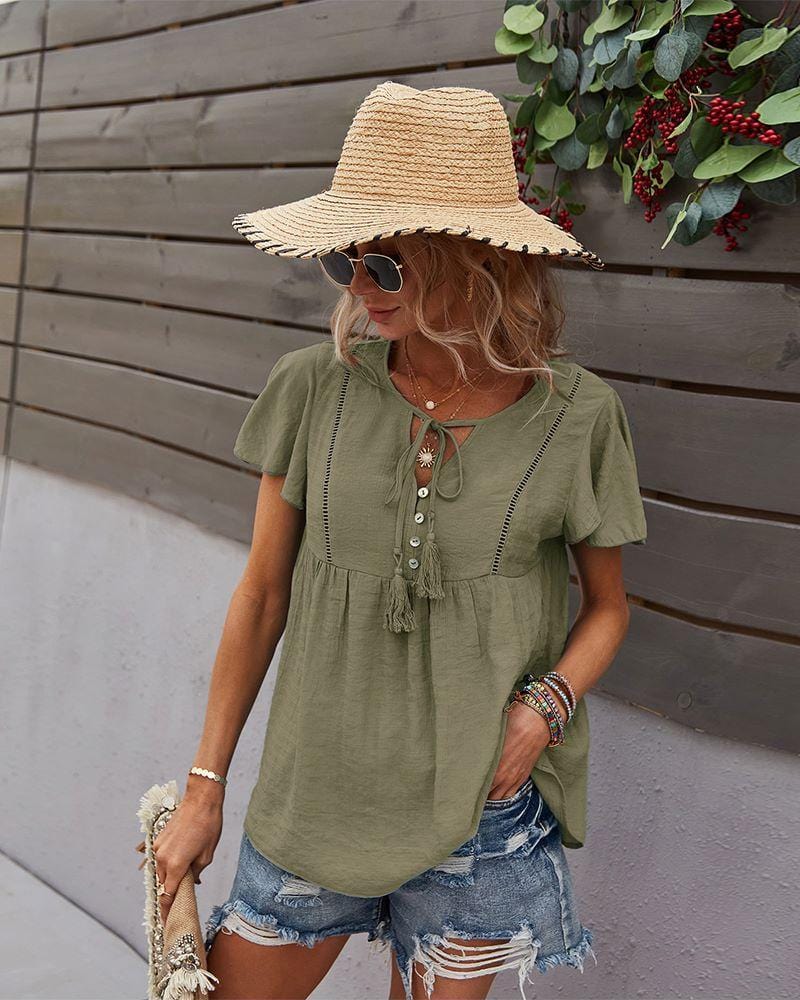 Blusa con mangas sueltas y cuello anudado