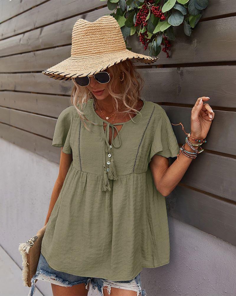 Blusa con mangas sueltas y cuello anudado