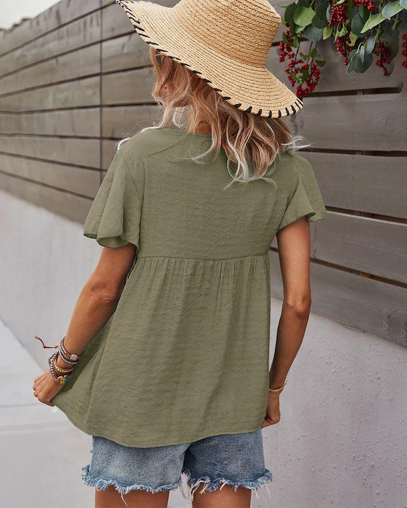 Blusa con mangas sueltas y cuello anudado