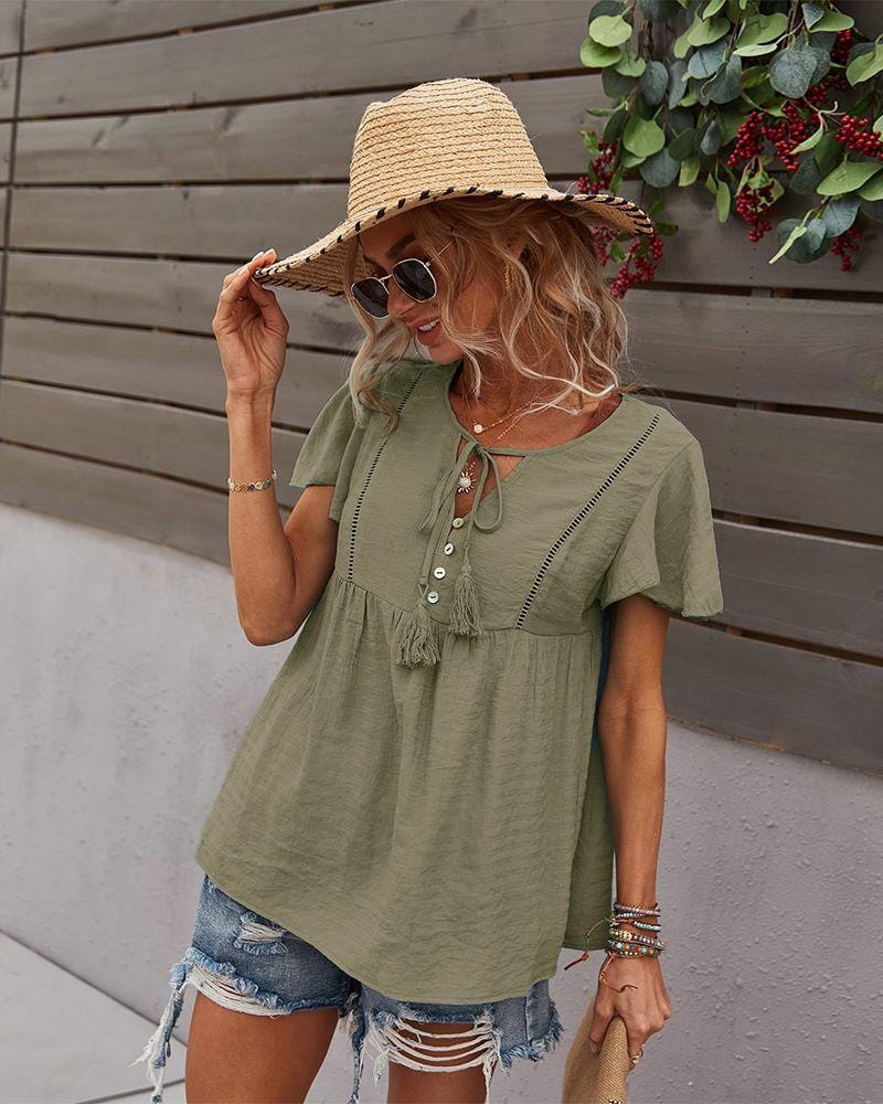 Blusa con mangas sueltas y cuello anudado
